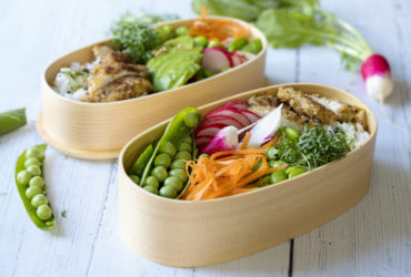 Japanese style bento lunch box with chicken, rice and vegetables